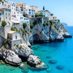 The clifftop town of Tropea in Calabria above a turquoise sea, with a church on a rocky promontory