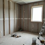 A half-finished room renovation with tools and materials left behind, illustrating a contractor who ghosted mid-project